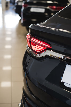 Close up detail on one of the LED taillight modern black carの写真素材