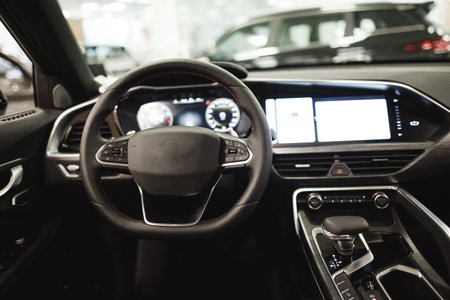 interior of an expensive car, steering wheel, panels. High quality photoの写真素材