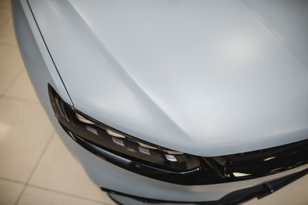 Modern car wrapped in grey color matte vinyl. High quality photo