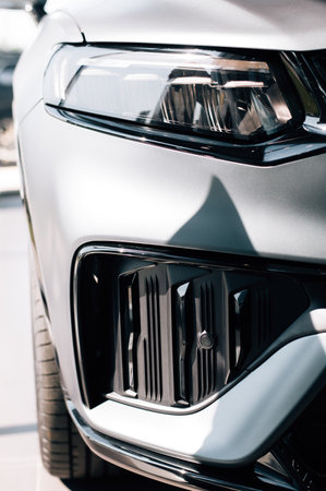 Modern car headlight close up photoの写真素材