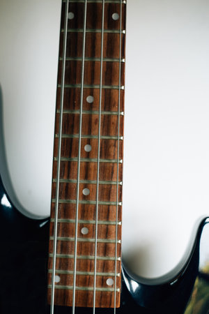 electric black guitar neck close up