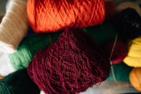 woolen threads of different colors in spoolsの写真素材
