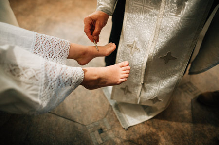 baptism ritual, priest anointed the girls feet