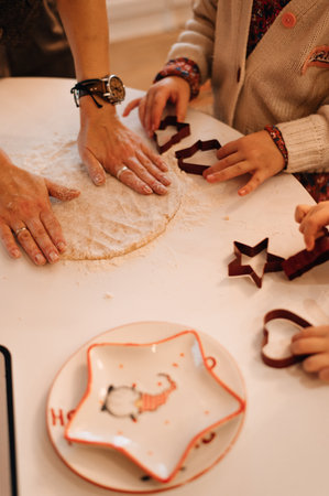 children bake gingerbread cookies at home. High quality photoの写真素材