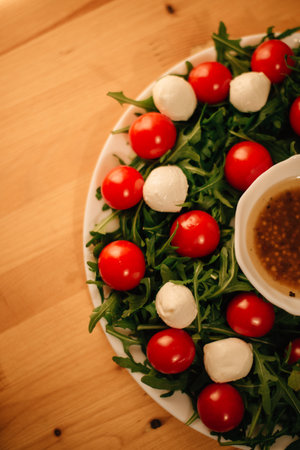 salad with cherry tomatoes, arugula and mozzarella. High quality photoの写真素材
