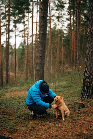 man with a dog in the forest. High quality photoの写真素材