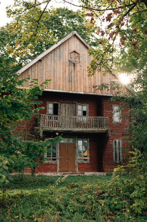 old wooden two-story house in the forest. High quality photoの写真素材