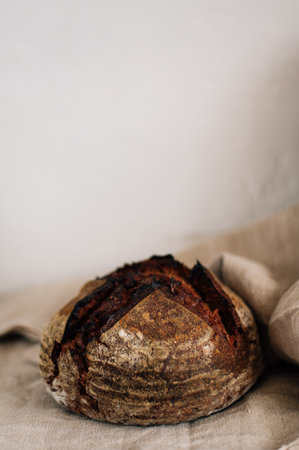 black homemade aromatic bread with a cut. High quality photoの写真素材