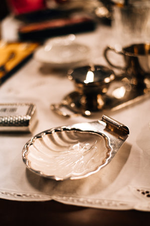 vintage silver bowl in the shape of a shell. High quality photoの写真素材