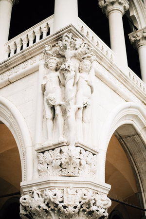 stucco in the form of children on the facade in Venice. High quality photoの写真素材