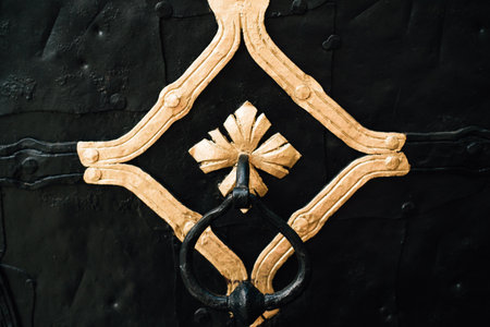 forged handle on antique doorsの写真素材