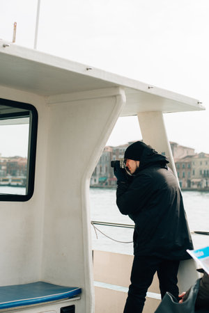 man taking pictures on a ship. High quality photoの写真素材