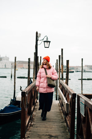 girl walking on a bridge in Venice. High quality photoの写真素材