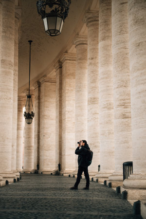 man in black taking pictures. High quality photoの写真素材