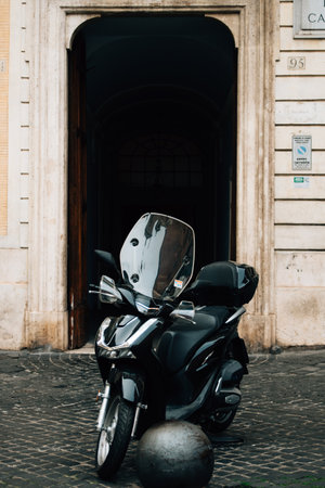 Black moped on the street in Rome.の写真素材