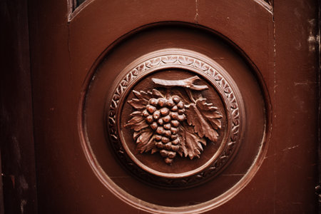 Bas-relief with grapes on the doors. High quality photoの写真素材