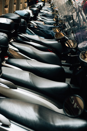 A close-up of a row of mopeds. High quality photoの写真素材