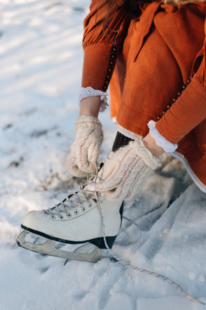 The girl puts on her skates. High quality photoの写真素材