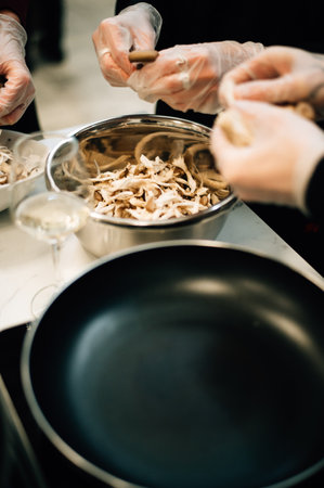 Slicing oyster mushrooms in the kitchen. High quality photoの写真素材