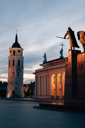 Illuminated Cathedral Square with Vilnius Cathedral and bell tower at nightの写真素材