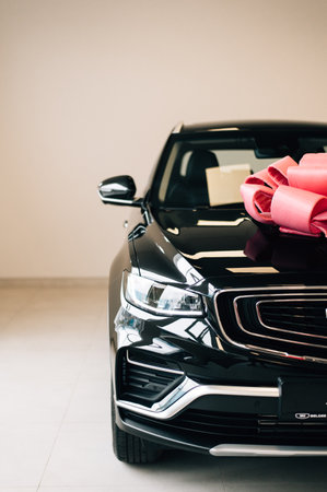 Black SUV with pink bow. High quality photo