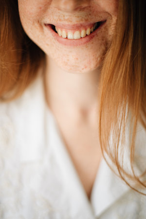 Redhead girl with freckles smiling. High quality photoの写真素材