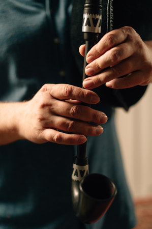 Hands of a bagpiper playing the bagpipes. High quality photoの写真素材