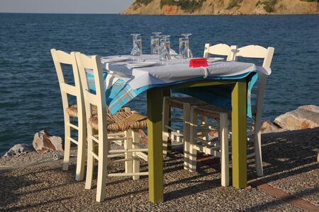 Restaurant in the open air by the sea, evening. Mediterranean Sea, South of Europe, Greece, Skopelos...