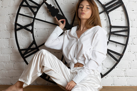Moscow a photoshoot in studio with a charming girl. A photoshoot in a light dressing gown of white...