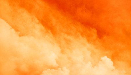 Orange sky with white clouds. Abstract background and texture for design.の素材