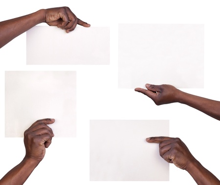 Hands holding sheets of paper isolated on white background の写真素材