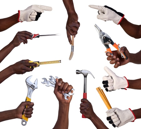 Hands holding tools isolated on white background の写真素材