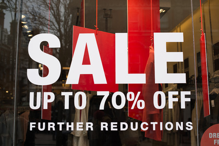 Sale Sign In A Clothing Store Window