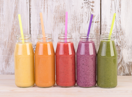Fruit smoothies variety in rainbow colorsの写真素材