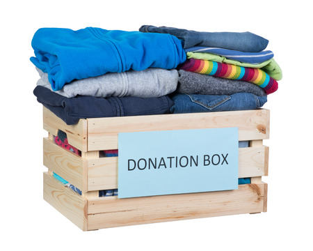 Clothes donations box isolated on white backgroundの写真素材