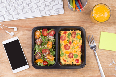 Lunch box with healthy diet meal on desk at workplace, top viewの写真素材