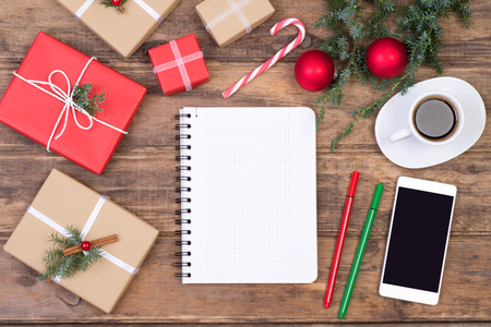 Blank notebook on wooden table with Christmas decorationの写真素材