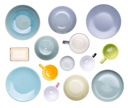 Colorful plates, bowls, cups and mugs isolated on white backgroundの写真素材