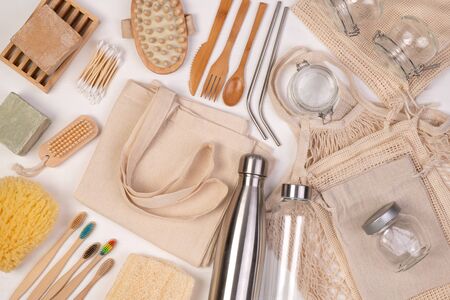 Zero waste eco friendly reusable objects such as reusable linen shopping bags, glass jars and wooden...