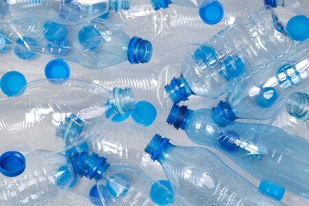 Plenty of plastic bottles on white background with copy spaceの写真素材