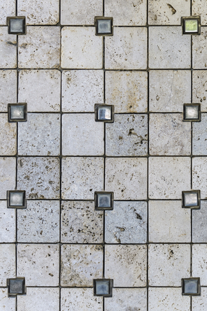 The texture of a fragment of a stone wall cladding. With metal elements.の写真素材