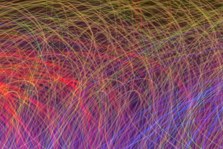 Photo with a group of chaotic multi-colored lights for an abstract colored background.