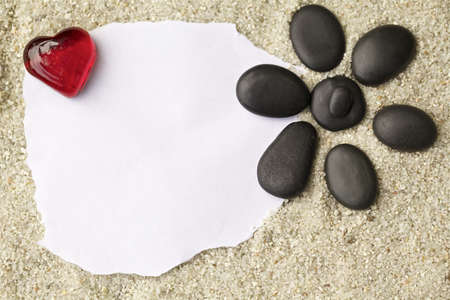Blank message on sand and pebblesの写真素材