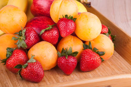 Ripe fruits on a wooden の写真素材
