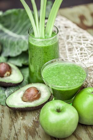 Healthy green smoothie with fresh fruit and vegetables.の写真素材