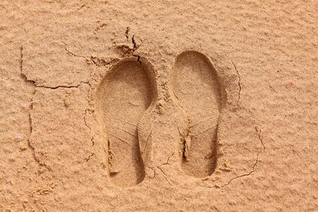 Footprint, sole of a shoe on the sandの写真素材