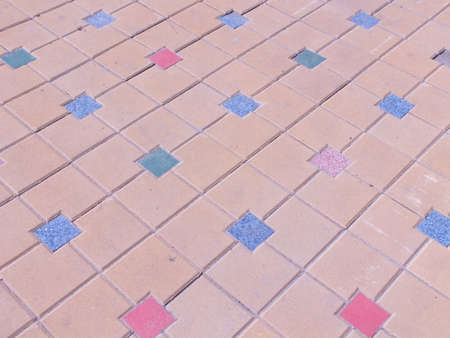 Pavement with colored squares as background