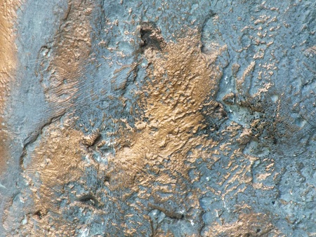 Uneven bronze surface with patina - to be used as backgroundの写真素材