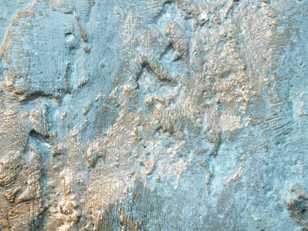 Uneven bronze surface with patina - to be used as backgroundの写真素材