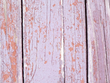 Wooden planks with partially come-off multi-colored paint - to be used as backgroundの写真素材